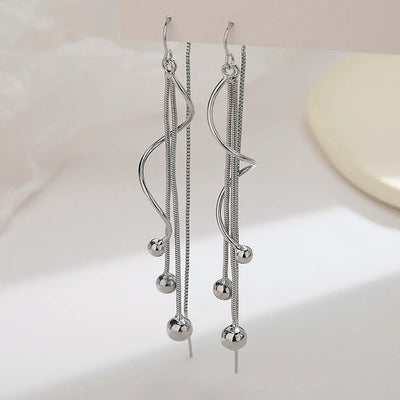 Harper Faux Threader Dangle Earrings  Long, interesting strand earrings with a faux threader at the back to add some extra movement.