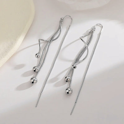 Harper Faux Threader Dangle Earrings  Long, interesting strand earrings with a faux threader at the back to add some extra movement.