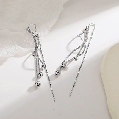 Harper Faux Threader Dangle Earrings  Long, interesting strand earrings with a faux threader at the back to add some extra movement.