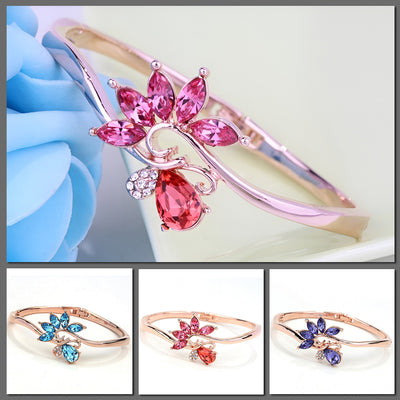 Helios Hinged Bangle - A beautiful bracelet with colourful crystals in an abstract starburst pattern.