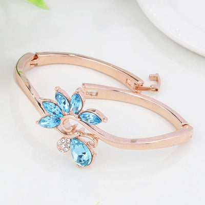 Helios Hinged Bangle - A beautiful bracelet with colourful crystals in an abstract starburst pattern.