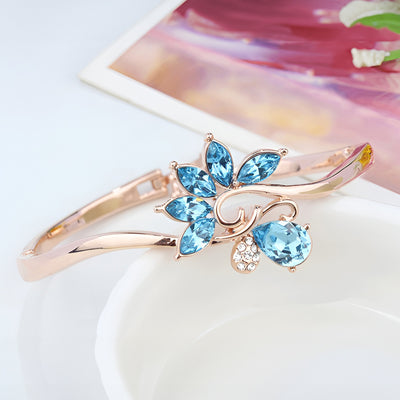 Helios Hinged Bangle - A beautiful bracelet with colourful crystals in an abstract starburst pattern.