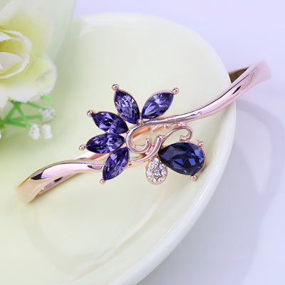 Helios Hinged Bangle - A beautiful bracelet with colourful crystals in an abstract starburst pattern.