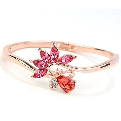 Helios Hinged Bangle - A beautiful bracelet with colourful crystals in an abstract starburst pattern.