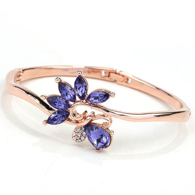Helios Hinged Bangle - A beautiful bracelet with colourful crystals in an abstract starburst pattern.