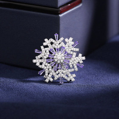 Hilde Rotatable Crystal Snowflake Brooch - A medium-sized crystal brooch featuring round white quartz and purple topaz arranged in a snowflake design.