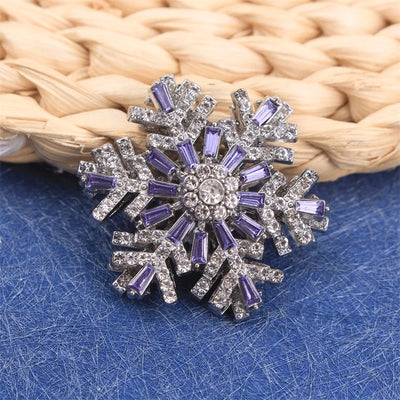 Hilde Rotatable Crystal Snowflake Brooch - A medium-sized crystal brooch featuring round white quartz and purple topaz arranged in a snowflake design.