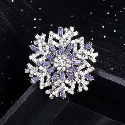 Hilde Rotatable Crystal Snowflake Brooch - A medium-sized crystal brooch featuring round white quartz and purple topaz arranged in a snowflake design.