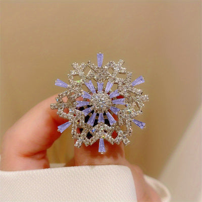 Hilde Rotatable Crystal Snowflake Brooch - A medium-sized crystal brooch featuring round white quartz and purple topaz arranged in a snowflake design.