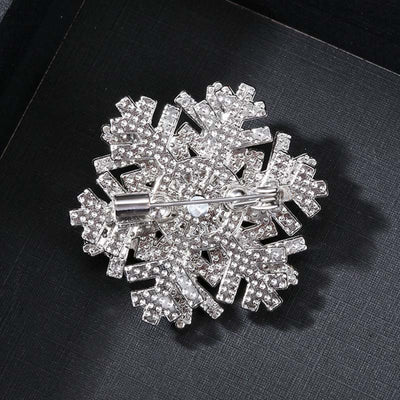 Hilde Rotatable Crystal Snowflake Brooch - A medium-sized crystal brooch featuring round white quartz and purple topaz arranged in a snowflake design.