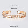 Hippolyta Stylized Woven Cuff Bangle - A sleek and elegant rose gold cuff bangle with a plaited, wave-like pattern on the outside and a fine mesh pattern on the inside.