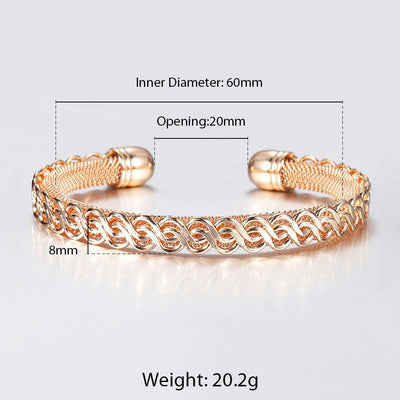 Hippolyta Stylized Woven Cuff Bangle - A sleek and elegant rose gold cuff bangle with a plaited, wave-like pattern on the outside and a fine mesh pattern on the inside.