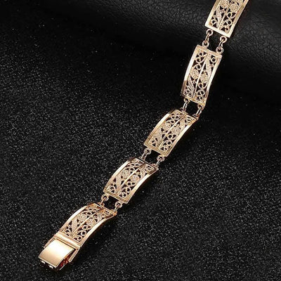 Iliana Cut-Out Link Bracelet - An elegant rose gold bracelet made of carved panels joined by chain links.