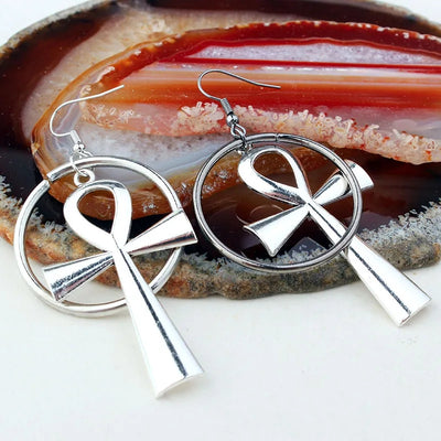 Isis Gothic Ankh Earrings - A pair of chunky silver-toned ankh earrings with a  round matching loop.
