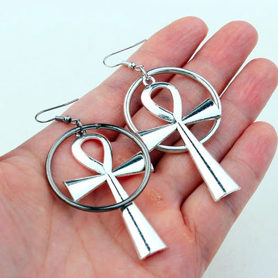 Isis Gothic Ankh Earrings - A pair of chunky silver-toned ankh earrings with a  round matching loop.