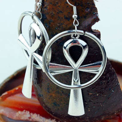 Isis Gothic Ankh Earrings - A pair of chunky silver-toned ankh earrings with a  round matching loop.