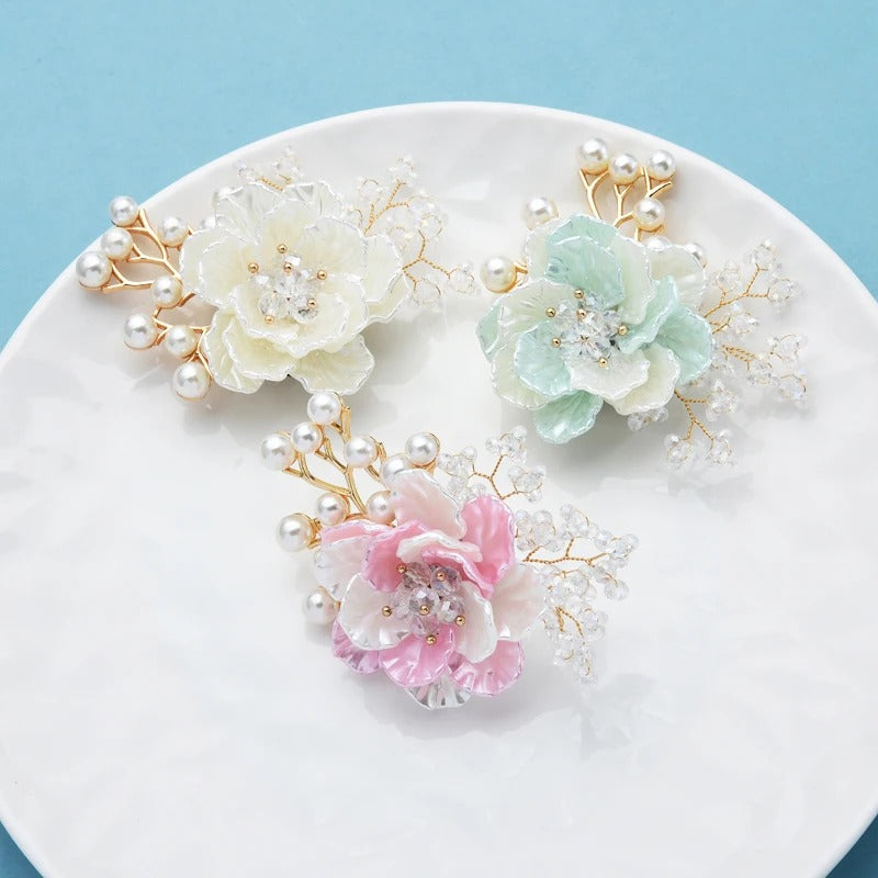 Jaelyn Pearlescent Cluster Brooch - A large, elegant flower-shaped brooch with pearlescent resin petals and lots of little crystals and pearls.