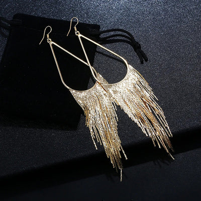 Jahzara Tassel Earrings - Long stylish statement dangles, featuring a hollow teardrop shape with tassels strung off it.