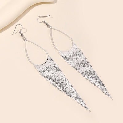 Jahzara Tassel Earrings - Long stylish statement dangles, featuring a hollow teardrop shape with tassels strung off it.