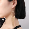Jahzara Tassel Earrings - Long stylish statement dangles, featuring a hollow teardrop shape with tassels strung off it.