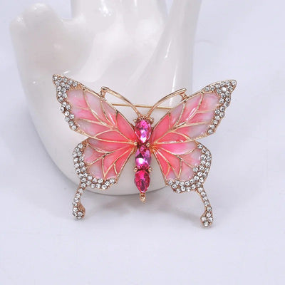 Josephine Butterfly Enamel Brooch - An adorable medium-sized brooch shaped like a stylised butterfly, available in blue, green, and two shades of pink.
