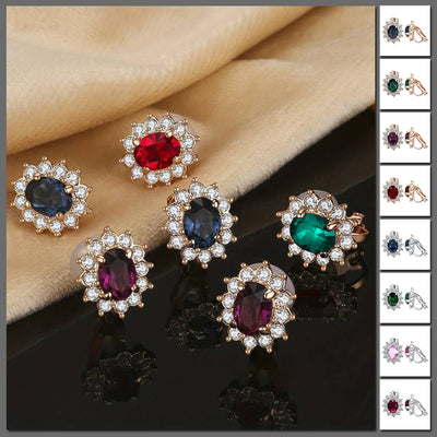 Juana Entourage Clip Earrings - A lovely, classic style earring featuring one large stone surrounded by 12 smaller stones.
