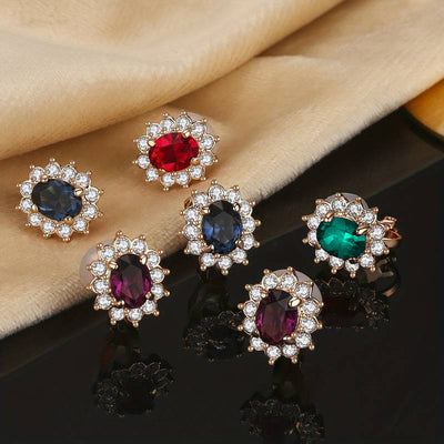 Juana Entourage Clip Earrings - A lovely, classic style earring featuring one large stone surrounded by 12 smaller stones.
