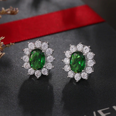 Juana Entourage Clip Earrings - A lovely, classic style earring featuring one large stone surrounded by 12 smaller stones.