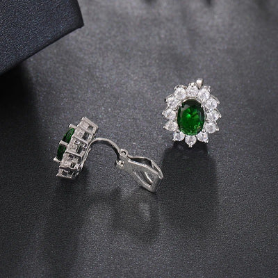 Juana Entourage Clip Earrings - A lovely, classic style earring featuring one large stone surrounded by 12 smaller stones.