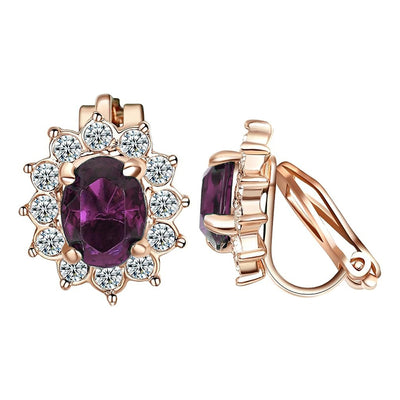Juana Entourage Clip Earrings - A lovely, classic style earring featuring one large stone surrounded by 12 smaller stones.