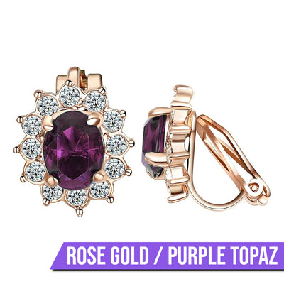 Juana Entourage Clip Earrings - A lovely, classic style earring featuring one large stone surrounded by 12 smaller stones.