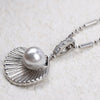 Kaimana Seashell Necklace - An elegant silver-coloured necklace featuring a seashell with a pearl at the end.