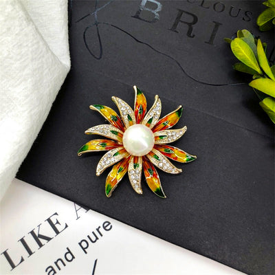 Kamla Lotus Blossom Enamel Brooch - A large decorative brooch shaped like a multi-petalled flower, available in blue/silver, green/gold, or rainbow colours.