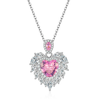 Katherine Luxury Crystal Pendant - A beautiful crystal pendant featuring a pink or blue topaz heart in the centre, surrounded by white topaz stones arranged to look like angel wings.