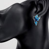Lacquer Wings Enamel Earrings - Vibrantly colourful enamel earrings with a butterfly motif, available in blue, green, orange, and purple.