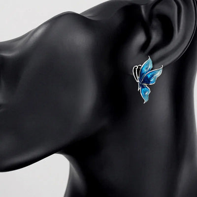 Lacquer Wings Enamel Earrings - Vibrantly colourful enamel earrings with a butterfly motif, available in blue, green, orange, and purple.