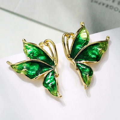 Lacquer Wings Enamel Earrings - Vibrantly colourful enamel earrings with a butterfly motif, available in blue, green, orange, and purple.