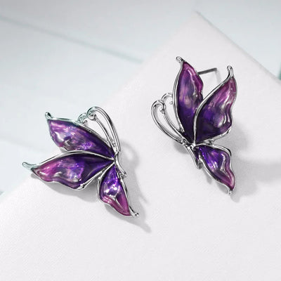 Lacquer Wings Enamel Earrings - Vibrantly colourful enamel earrings with a butterfly motif, available in blue, green, orange, and purple.