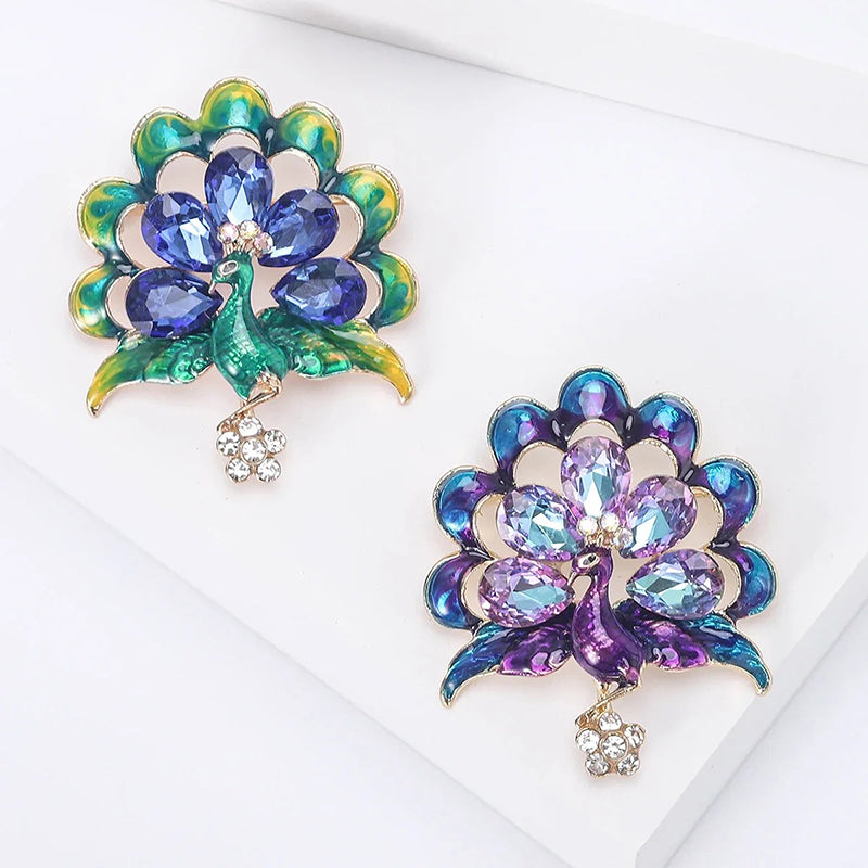 Lakshmi Crystal Peacock Brooch - A lovely stylized peacock brooch featuring glossy enamel paint and sparkling crystals.
