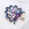 Lakshmi Crystal Peacock Brooch - A lovely stylized peacock brooch featuring glossy enamel paint and sparkling crystals.