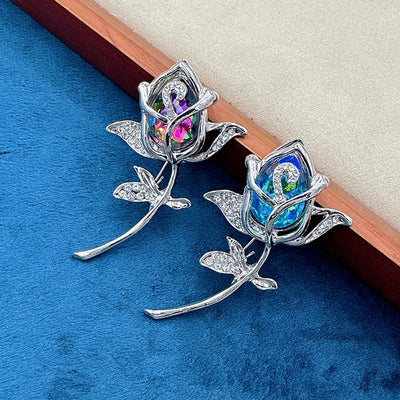 Laleh Crystal Tulip Brooch - Slender, elegant floral brooches featuring a coloured stone on the flower head and smaller crystals embedded in the leaves.