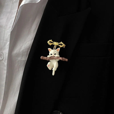 Little Adventurer Climbing Kitten Brooch - An adorable 3D sculpted resin kitten hanging from a stylised branch.