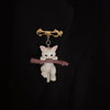 Little Adventurer Climbing Kitten Brooch - An adorable 3D sculpted resin kitten hanging from a stylised branch.