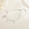 Luna Moon & Stars Charm Bracelet - A very delicate silver coloured charm bracelet decorated with moon and stars charms.