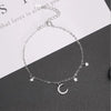 Luna Moon & Stars Charm Bracelet - A very delicate silver coloured charm bracelet decorated with moon and stars charms.