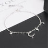 Luna Moon & Stars Charm Bracelet - A very delicate silver coloured charm bracelet decorated with moon and stars charms.