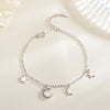 Luna Moon & Stars Charm Bracelet - A very delicate silver coloured charm bracelet decorated with moon and stars charms.