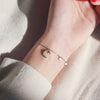 Luna Moon & Stars Charm Bracelet - A very delicate silver coloured charm bracelet decorated with moon and stars charms.