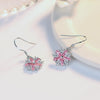 Asuka Cherry Blossom French Hook Earrings - Small, delicate crystal earrings shaped like little flowers.