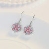 Asuka Cherry Blossom French Hook Earrings - Small, delicate crystal earrings shaped like little flowers.